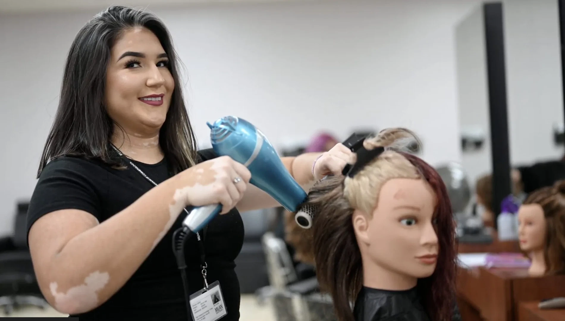 Cosmetology student practices in El Paso Texas salon floor